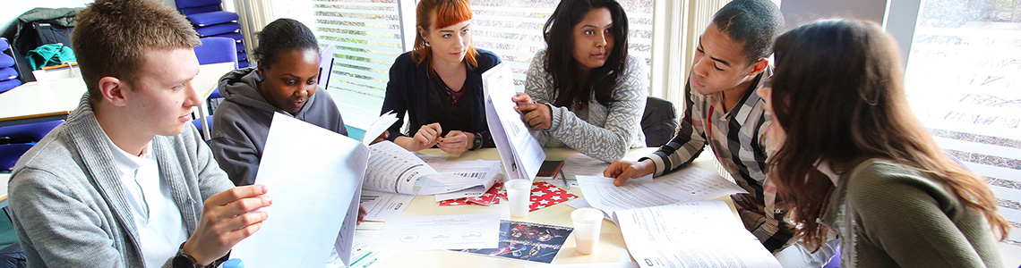 Several students gathered around a table