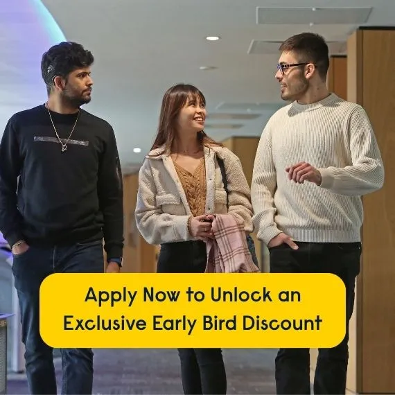 Three students walk through a campus corridor, with text overlay: “Apply Now to Unlock an Exclusive Early Bird Discount”.